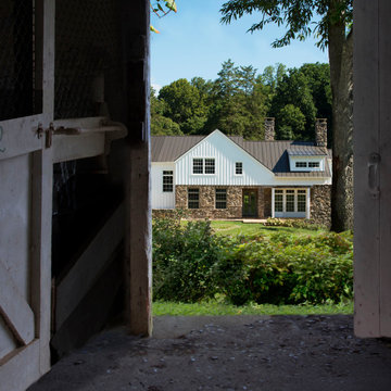 American Farmhouse with Board and Batten and Rustic Stone