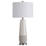 StyleCraft - Slightly Tapered Two Tone Round Ceramic Lamp, Brushed Silver Base - The gray and ivory colors of the two-tone frame, combined with the brushed silver base and white shade, make the Evian table lamp a beautiful contemporary accent piece. The slim frame has a slightly tapered shape and sits on a circular metal base. With a matching brushed steel finial and three-way operation, this ivory and gray table lamp brings stylish illumination to a living room or family room.