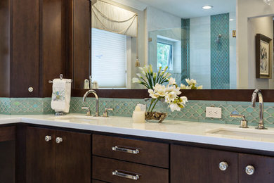 Example of a mid-sized transitional master blue tile and glass sheet porcelain tile alcove shower design in Miami with flat-panel cabinets, dark wood cabinets, beige walls, an undermount sink and quartz countertops