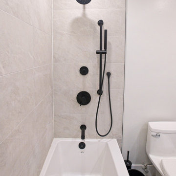 White Bathtub with Matte-Black Shower and Wall Controls | Downtown Toronto