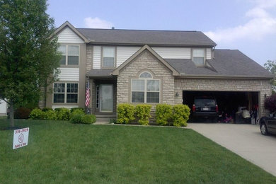 Large traditional blue two-story wood exterior home idea in Columbus