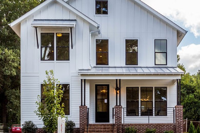 Mid-sized transitional white two-story vinyl exterior home idea in Raleigh