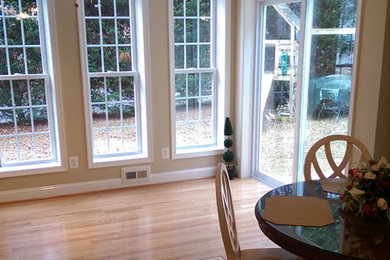 This is an example of a mid-sized modern back porch design in DC Metro.