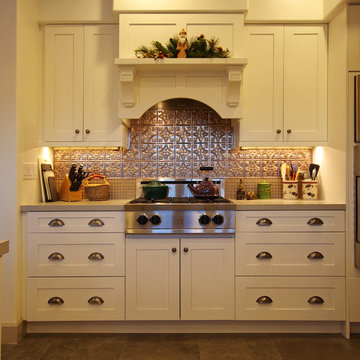 Kitchen with Stainless Steel Stove and Copper backsplash