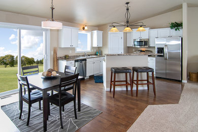Trendy l-shaped medium tone wood floor open concept kitchen photo in Other with shaker cabinets, white cabinets, granite countertops, stainless steel appliances and an island