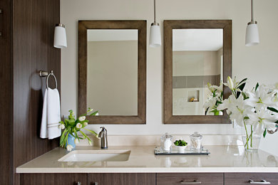 Mid-sized transitional master beige tile and ceramic tile mosaic tile floor bathroom photo in Toronto with flat-panel cabinets, medium tone wood cabinets, beige walls, an undermount sink and marble countertops