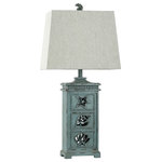 StyleCraft Home Collection - River Crest | Coastal Table Lamp With Night Light - Showcasing coastal-inspired flair, the ceramic frame of this table lamp has cutout seashell designs and a distressed light blue finish. The matching blue finial atop the taupe fabric hardback shade is also in the shape of a seashell. Enhance nautical decor in a bedroom, office, hallway, dining room, or living room with this ocean-inspired lamp.