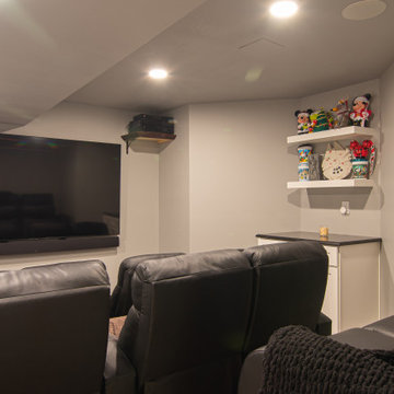 Basement Utilizing Open Space to Shoot Pool and Watch Favorite Sports Team