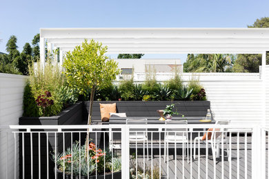 Inspiration for a small modern rooftop deck in Melbourne.