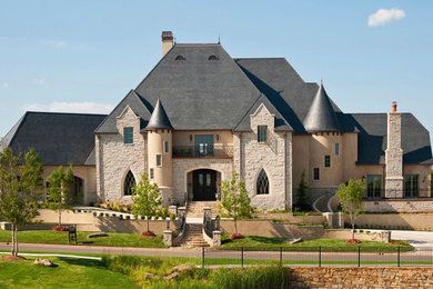 Photo of an expansive traditional three-storey beige exterior in Dallas with mixed siding and a hip roof.