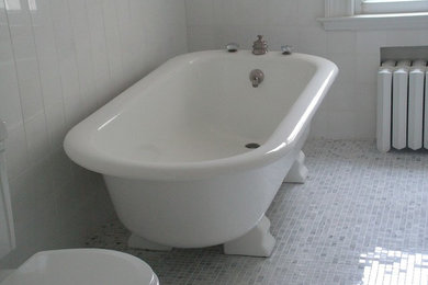 Mid-sized ornate master white tile and marble tile marble floor and white floor alcove shower photo in New York with furniture-like cabinets, white cabinets, an undermount tub, a two-piece toilet, white walls, an undermount sink, marble countertops, a hinged shower door and white countertops