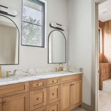 Warm Natural Wood Bathroom with Marble Countertops + Vertical Tile Detail