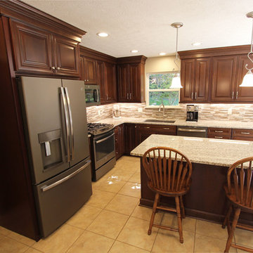 Waypoint Cherry Chocolate Cabinets and Giallo Ornamental Granite Countertops