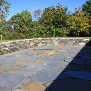 Stone wall and stone patio.
