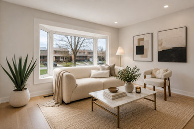 Inspiration for a mid-sized contemporary open concept light wood floor, brown floor and coffered ceiling living room remodel in Toronto with multicolored walls, no fireplace and no tv