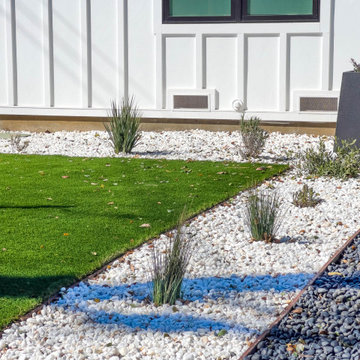 Modern Low-Maintenance Front Yard with Custom Fence and Artificial Turf