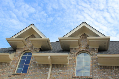 This is an example of a large traditional three-storey brick exterior in Other with a gable roof.