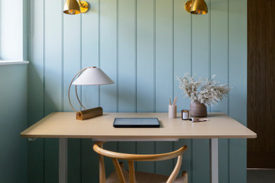 Design ideas for a contemporary study in Buckinghamshire with blue walls and panelled walls.
