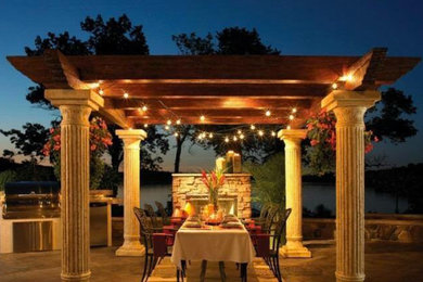 Design ideas for a medium sized traditional back patio in Nashville with a fire feature, concrete slabs and a gazebo.