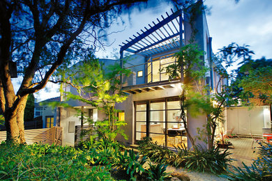 Mid-sized modern home design in Melbourne.