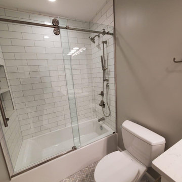 Bathroom remodeled With Double Sink, Standing Shower, Door Mirror & Flushing Toi