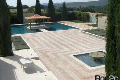 Inspiration for a mediterranean garden in Other with natural stone paving.