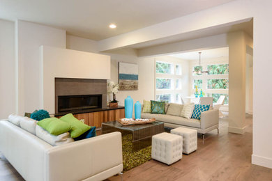 Living room - contemporary open concept living room idea in Seattle with a ribbon fireplace and a tile fireplace