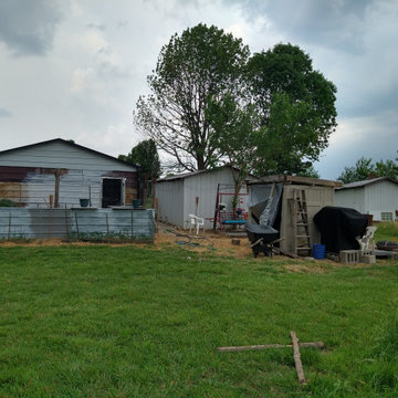Small raised enclosed garden and patio area