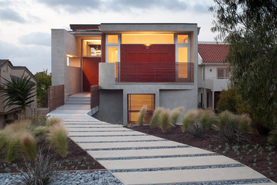 Design ideas for a large contemporary two-storey beige exterior in San Diego.