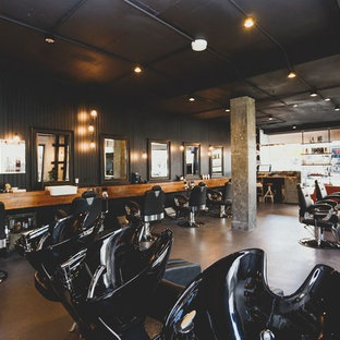 Inspiration for a medium sized urban look-out basement in Sydney with black walls, concrete flooring, no fireplace and grey floors.