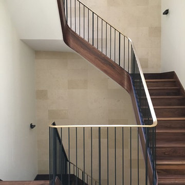 Walnut Stairs with Bronze Handrail and Iron Balusters