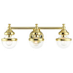 Livex Lighting - Livex Lighting Oldwick 3 Light Polished Brass Vanity Sconce With Clear Glass - Sleek and simple lines define this beautiful polished brass finish three-light vanity sconce from the Oldwick collection. The clean, bold look of modernity blends with a raw industrial inspiration and hand blown clear glass give this design a versatile and eclectic look that works with nearly any style of home decor.