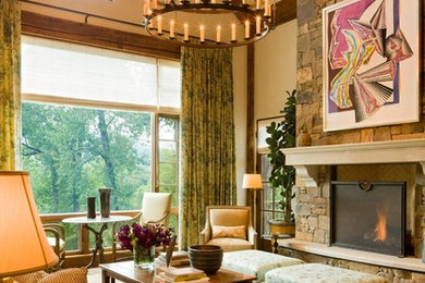 Large arts and crafts formal and open concept medium tone wood floor and brown floor living room photo in Denver with white walls, a standard fireplace, a stone fireplace and no tv