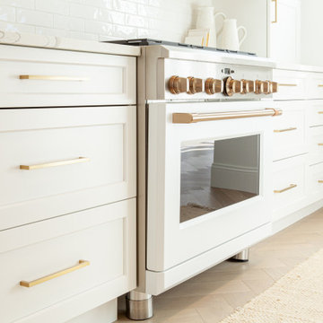 All White Transitional Kitchen with Herringbone Wood Floor