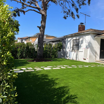 Artificial Turf Backyard with Organic Stepping Stone Path & Mature Tree