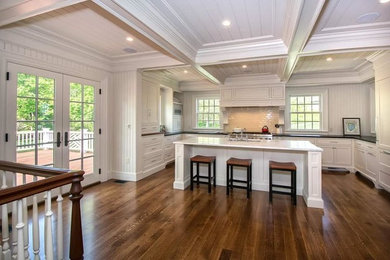 Eat-in kitchen - large transitional u-shaped dark wood floor eat-in kitchen idea in Boston with an undermount sink, recessed-panel cabinets, white cabinets, marble countertops, white backsplash, wood backsplash, paneled appliances and an island