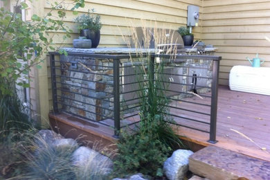 Example of a small classic patio kitchen design in Other with decking and no cover