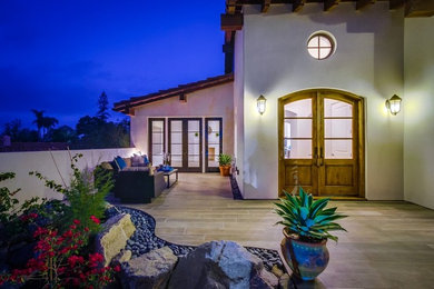 Mid-sized southwest front yard tile patio container garden photo in San Diego with no cover