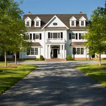 Traditional front exterior with Hardie siding and a wood shake roof