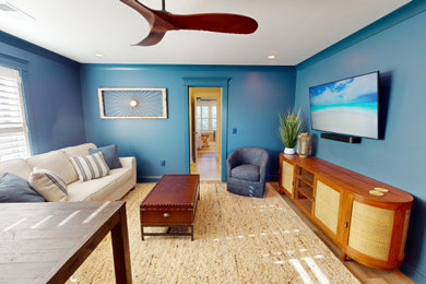 Example of a beach style family room design in Charleston