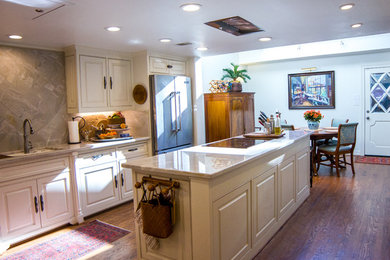 Traditional galley eat-in kitchen in Dallas with medium hardwood floors.