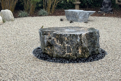 This is an example of an asian backyard landscaping in Los Angeles.