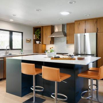 Walnut Kitchen Cabinetry with Blue Accent Island