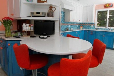 Design ideas for a mid-sized eclectic u-shaped separate kitchen in Portland Maine with shaker cabinets, blue cabinets, concrete benchtops, blue splashback, ceramic splashback, ceramic floors and a peninsula.