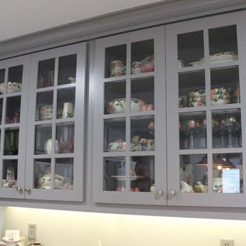 White Upper Cabinet and Gray Base Cabinet Kitchen With Quartz Counters