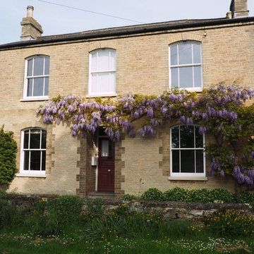 Arched Ultimate Rose Sash Windows in Bedfordshire, with Wisteria