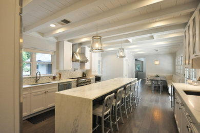 Eat-in kitchen - large country medium tone wood floor and gray floor eat-in kitchen idea in St Louis with an undermount sink, recessed-panel cabinets, white cabinets, marble countertops, white backsplash, marble backsplash, stainless steel appliances and an island