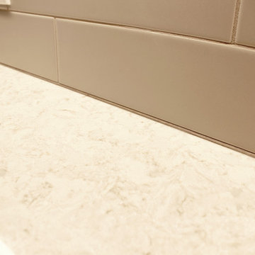 White Kitchen with Quartz Countertop, Galley Workstation and Large Subway Tile