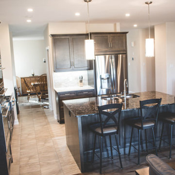 Custom kitchen and kitchen island with a view of the dining room