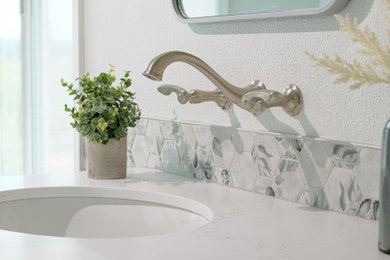 Mid-sized transitional master gray tile and glass tile porcelain tile, beige floor and double-sink japanese bathtub photo in Portland with flat-panel cabinets, light wood cabinets, white walls, an undermount sink, quartz countertops, white countertops and a built-in vanity